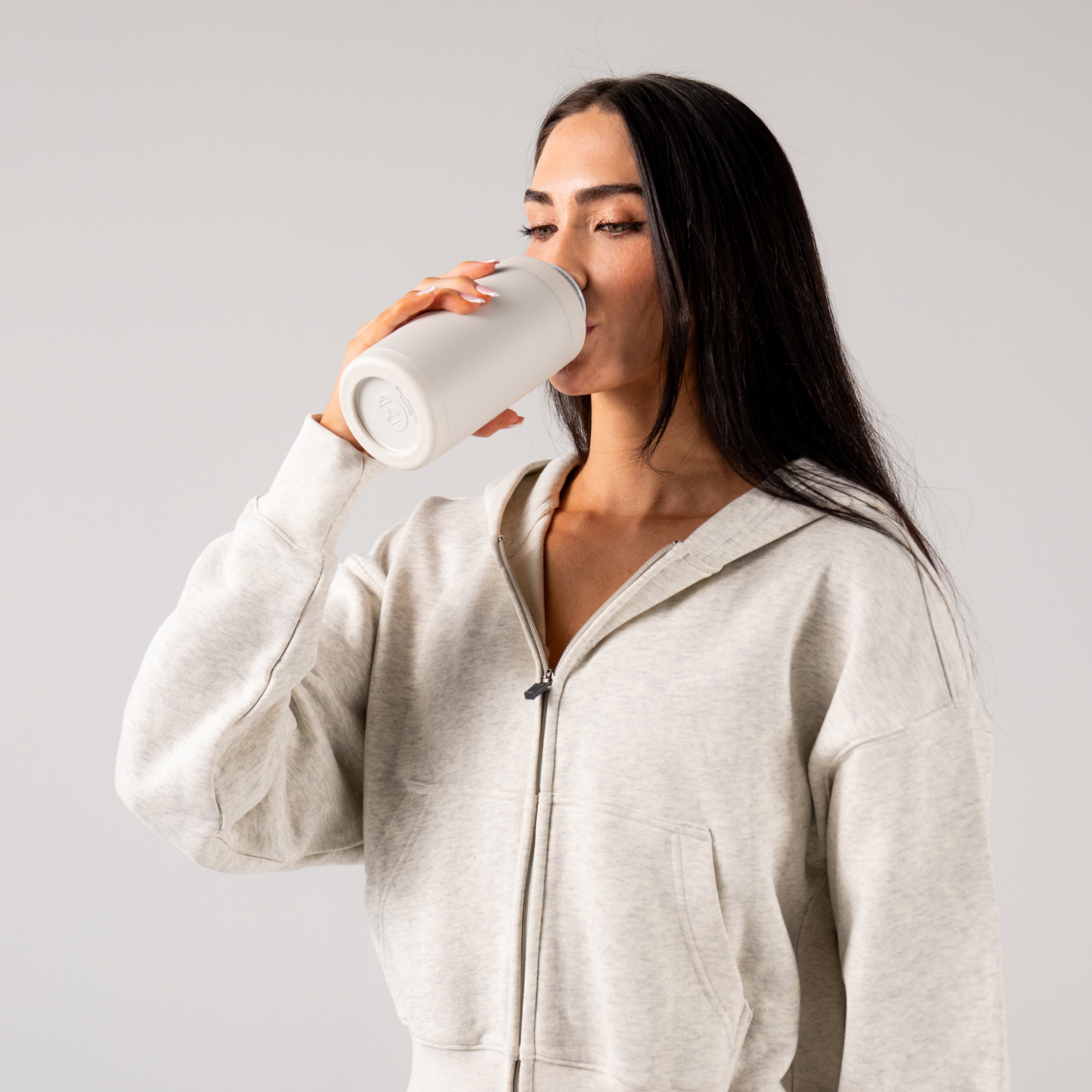 Woman Drinking from HydroJug Linen Can Cooler 16oz